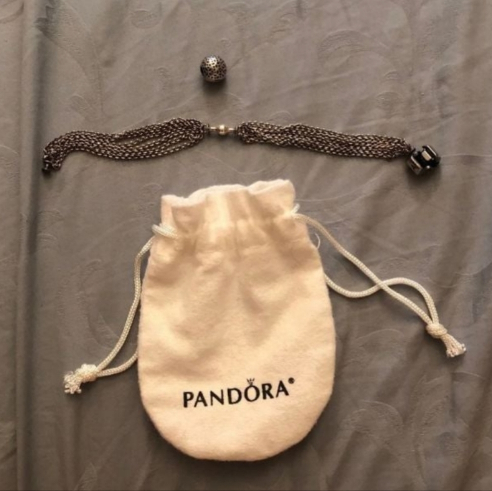 Authentic Pandora multi chain bracelet RARE RETIRED. Includes snap on charm.